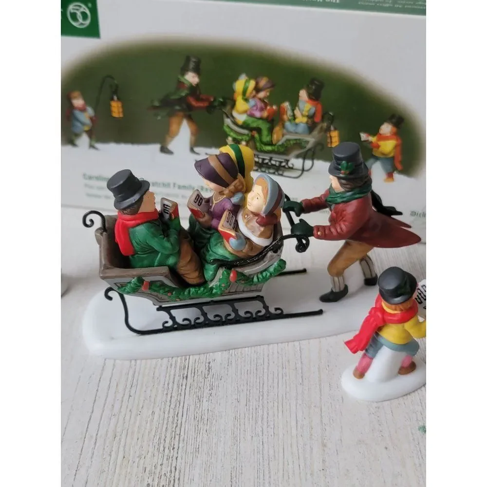 Dept 56 58396 Caroling With The Cratchit Family (Revisited) village accessory xm